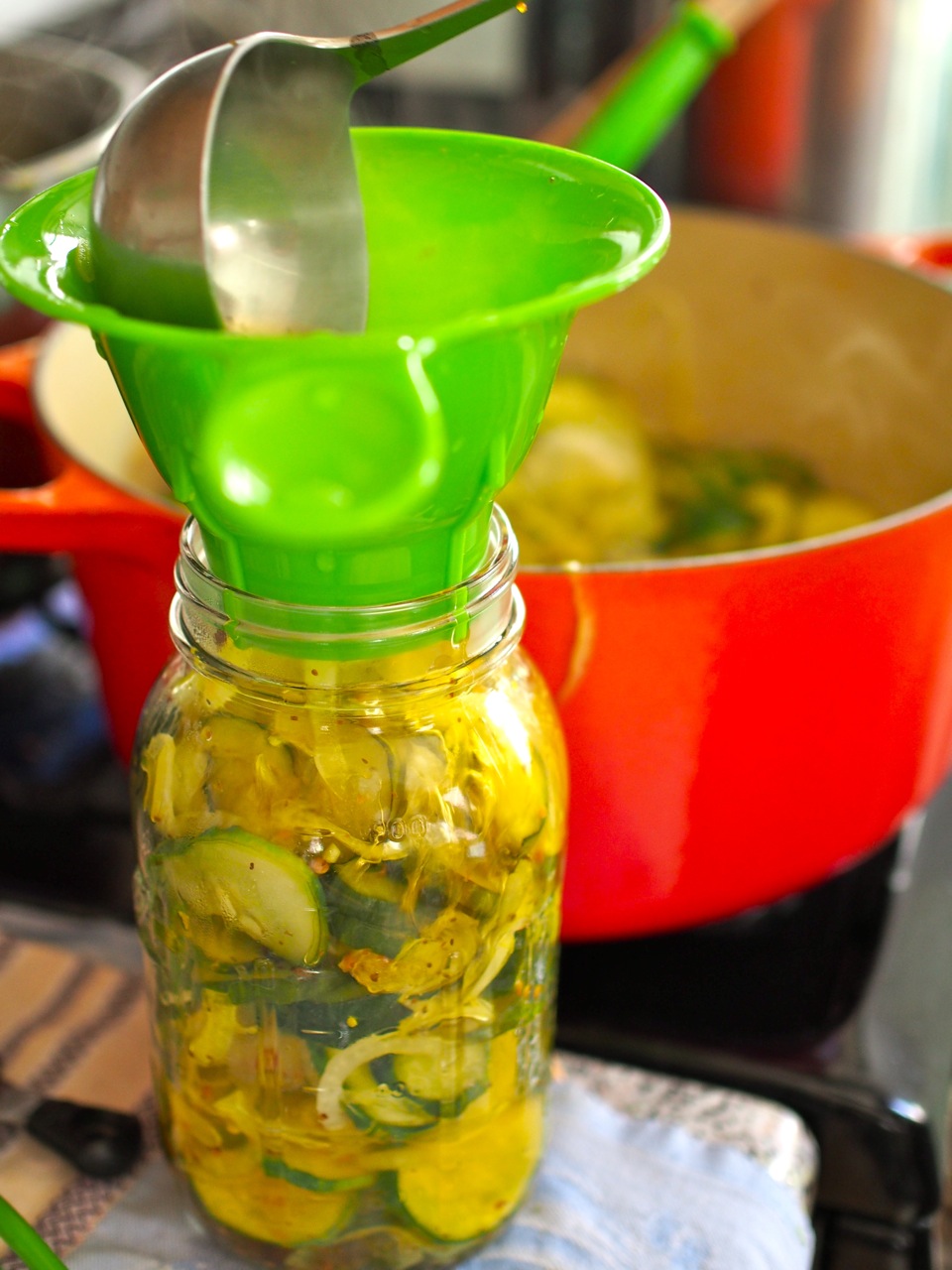Filling jars with bread-and-butter pickles